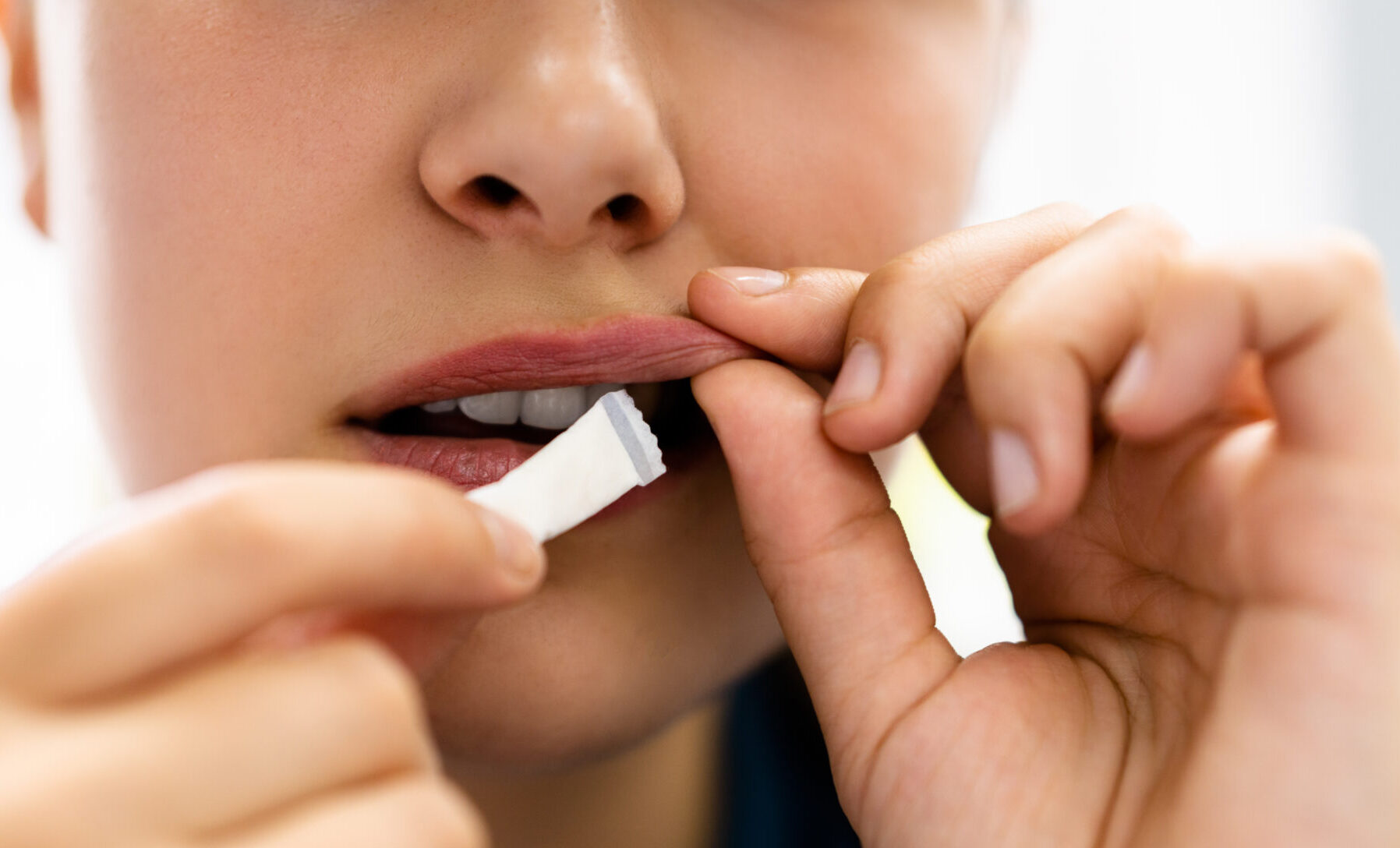 Woman Chewing Wet Moist Nicotine Product